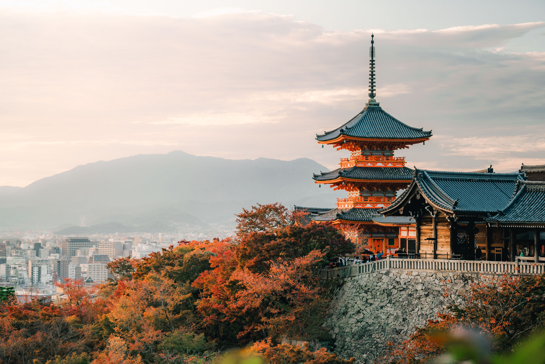 A Kyoto pagoda overlooking the city and autumn foliage